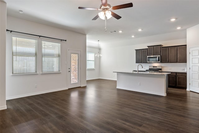 855 Revere Ct, Fate, TX 75189 - kitchen featuring stainless steel appliances, open floor plan, ceiling fan, a sink, and recessed lighting