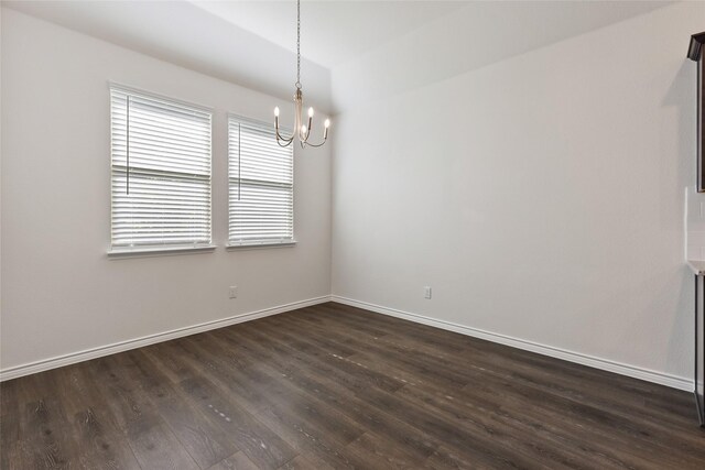855 Revere Ct, Fate, TX 75189 - spare room featuring dark wood finished floors, a chandelier, and baseboards