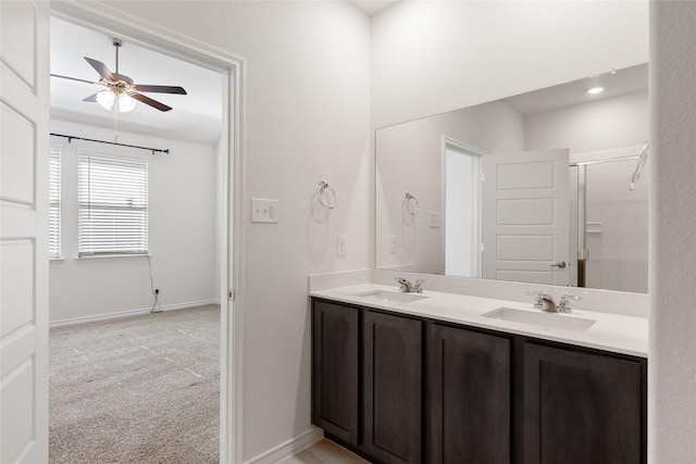 855 Revere Ct, Fate, TX 75189 - full bathroom featuring double vanity, a ceiling fan, baseboards, and a shower