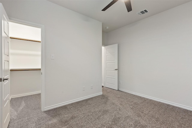 855 Revere Ct, Fate, TX 75189 - unfurnished bedroom with carpet flooring, baseboards, ceiling fan, and a spacious closet