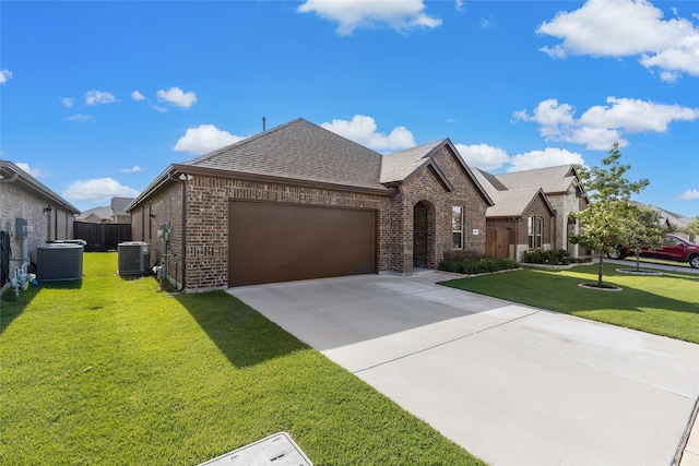 855 Revere Ct, Fate, TX 75189 - french provincial home with brick siding, a shingled roof, a garage, central AC, and concrete driveway