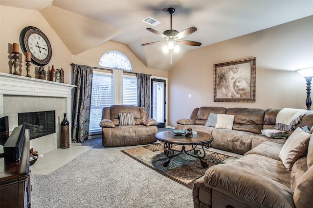 2318 Sparrow Dr, Forney, TX 75126 - carpeted living area featuring a ceiling fan, vaulted ceiling, and a tile fireplace
