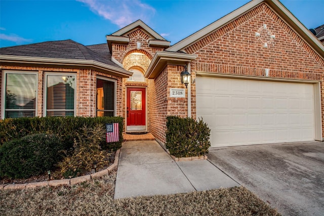 2318 Sparrow Dr, Forney, TX 75126 - view of front facade with brick siding, driveway, and a garage