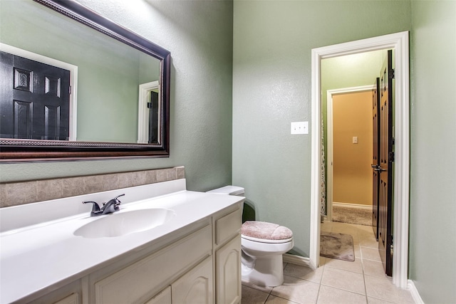 2318 Sparrow Dr, Forney, TX 75126 - half bath featuring toilet, tile patterned floors, vanity, and baseboards