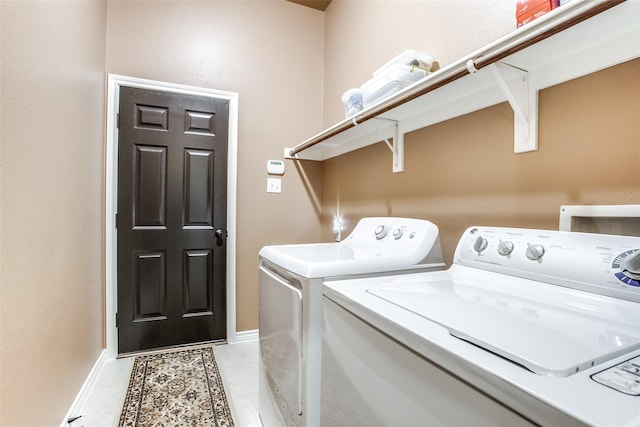 2318 Sparrow Dr, Forney, TX 75126 - washroom with washing machine and clothes dryer, light tile patterned floors, and baseboards