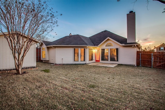 2318 Sparrow Dr, Forney, TX 75126 - back of house at dusk featuring a chimney, a patio, and roof with shingles