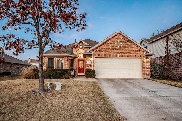 2318 Sparrow Dr, Forney, TX 75126 - traditional-style home with brick siding, a garage, driveway, and a front yard