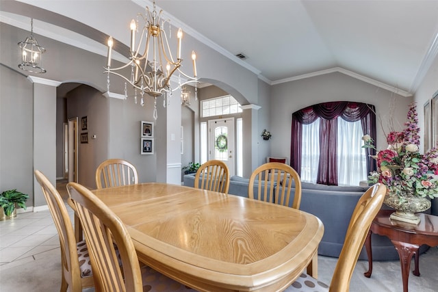 3832 Creekside Ln, Carrollton, TX 75010 - dining space with arched walkways, vaulted ceiling, a chandelier, light tile patterned floors, and crown molding