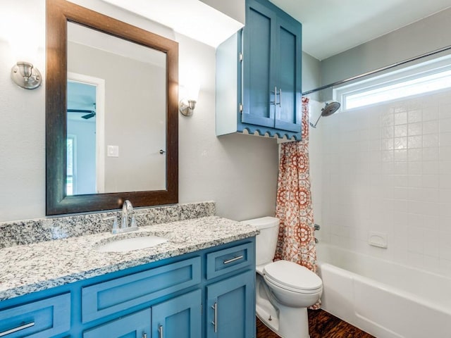 4857 Fallon Pl, Dallas, TX 75227 - bathroom featuring toilet, vanity, shower / bath combo, wood finished floors, and a ceiling fan