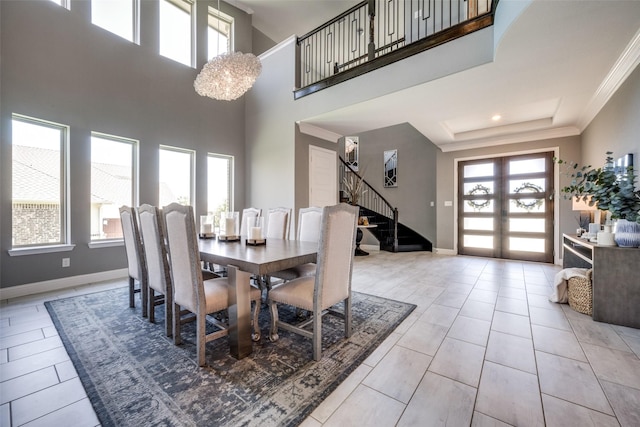 433 Silver Chase Dr, Keller, TX 76248 - dining space with stairway, healthy amount of natural light, baseboards, a towering ceiling, and crown molding