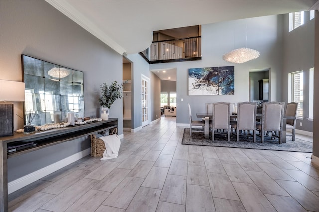 433 Silver Chase Dr, Keller, TX 76248 - dining space featuring baseboards, a towering ceiling, wood finished floors, and ornamental molding