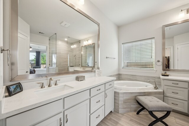 5901 Kildare Ct, Mckinney, TX 75071 - ensuite bathroom featuring vanity, a garden tub, and a shower