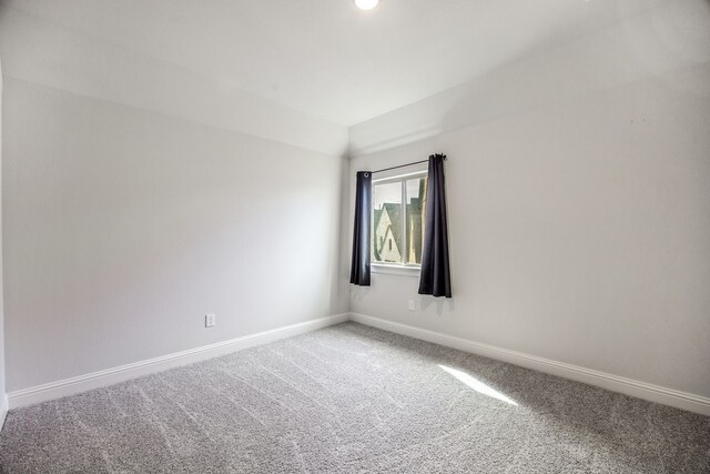 5901 Kildare Ct, Mckinney, TX 75071 - spare room featuring carpet, baseboards, and vaulted ceiling