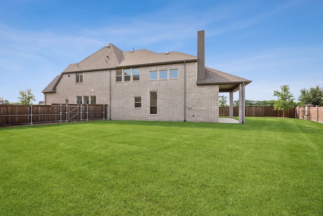 5901 Kildare Ct, Mckinney, TX 75071 - rear view of property with a chimney, brick siding, and roof with shingles