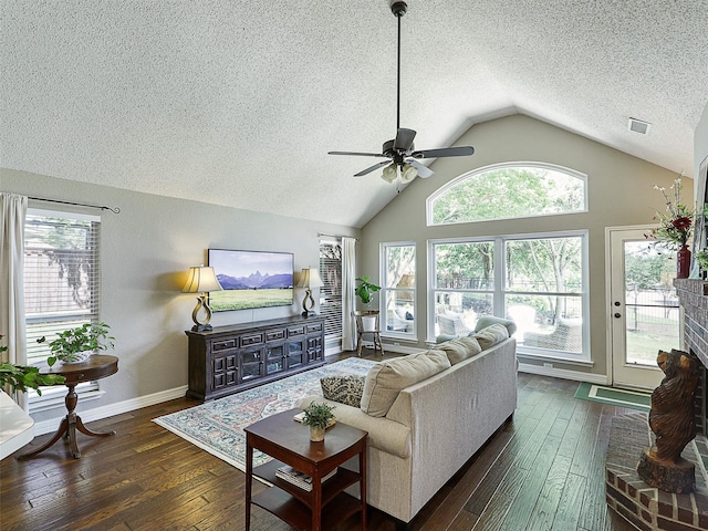 6023 Vista Ln, Sachse, TX 75048 - living area featuring a ceiling fan, a textured ceiling, vaulted ceiling, dark wood-style flooring, and healthy amount of natural light
