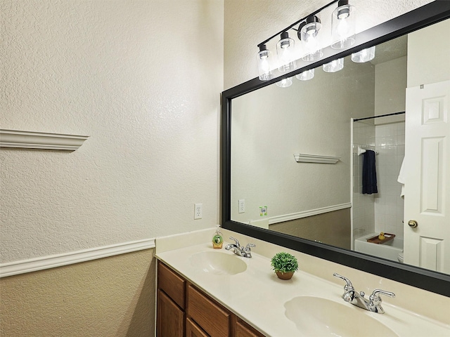 6023 Vista Ln, Sachse, TX 75048 - bathroom with double vanity, a textured wall, and shower / washtub combination