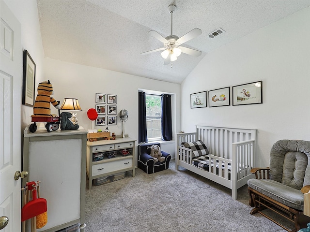 6023 Vista Ln, Sachse, TX 75048 - bedroom with lofted ceiling, carpet, a crib, a textured ceiling, and a ceiling fan