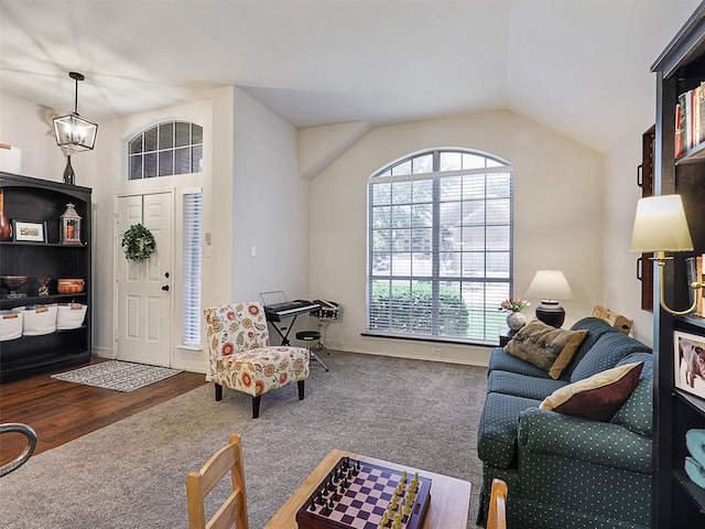 6023 Vista Ln, Sachse, TX 75048 - carpeted living room featuring vaulted ceiling and wood finished floors