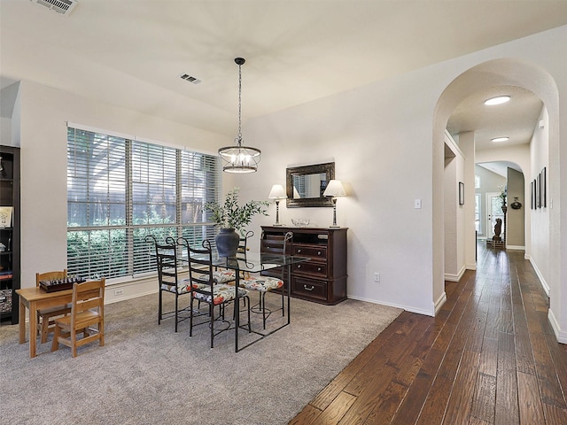 6023 Vista Ln, Sachse, TX 75048 - dining room with wood-type flooring, arched walkways, and baseboards