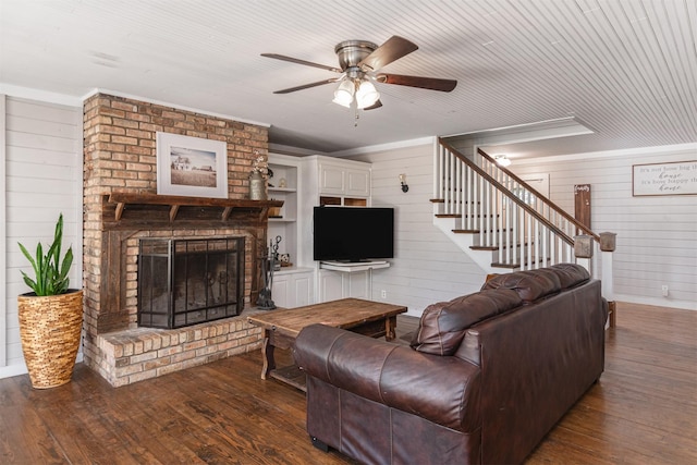 1147 Vz County Road 3417, Wills Point, TX 75169 - living room featuring ceiling fan, a brick fireplace, wood finished floors, wooden walls, and stairs