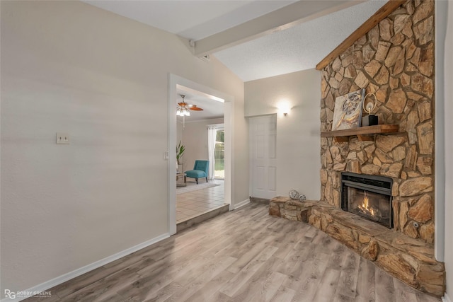 4102 Glen St, Bossier City, LA 71112 - unfurnished living room with a stone fireplace, wood finished floors, ceiling fan, and baseboards