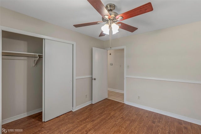 4102 Glen St, Bossier City, LA 71112 - unfurnished bedroom with wood finished floors, a closet, baseboards, and ceiling fan