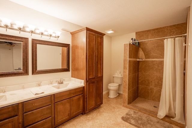 1343 Buster Chatham Rd, Waco, TX 76705 - bathroom featuring double vanity, a tile shower, toilet, and tile patterned flooring