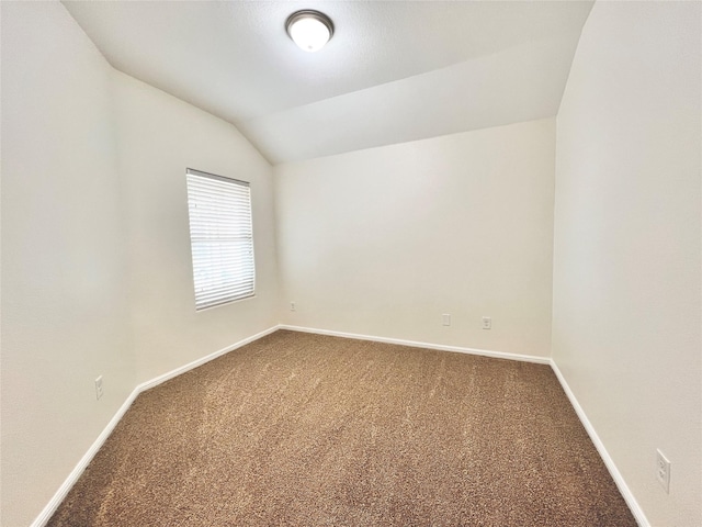 6940 Freeboard Way, Fort Worth, TX 76179 - spare room with dark carpet, baseboards, and lofted ceiling