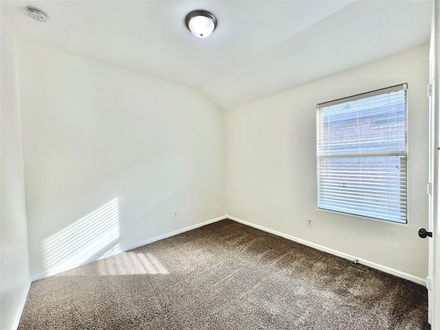 6940 Freeboard Way, Fort Worth, TX 76179 - unfurnished room with dark carpet, vaulted ceiling, a smoke detector, and baseboards