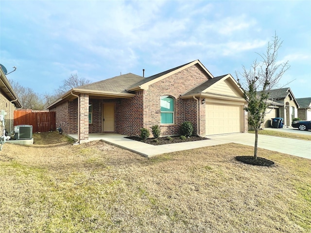 6940 Freeboard Way, Fort Worth, TX 76179 - ranch-style home featuring cooling unit, driveway, an attached garage, and brick siding
