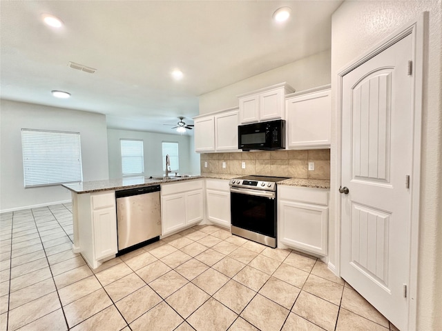 6940 Freeboard Way, Fort Worth, TX 76179 - kitchen with stainless steel appliances, a sink, backsplash, light tile patterned floors, and ceiling fan