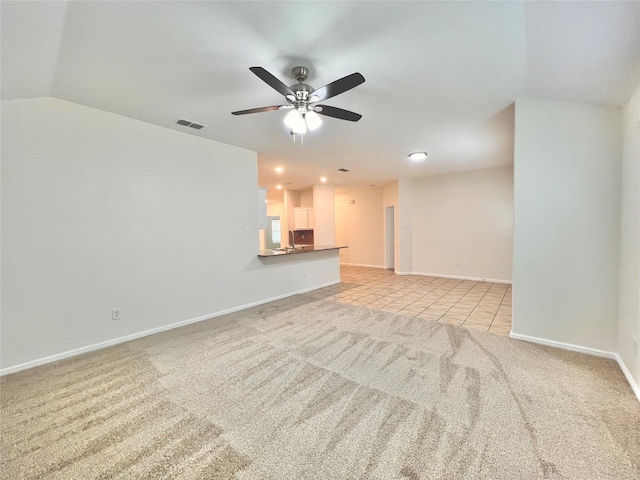 6940 Freeboard Way, Fort Worth, TX 76179 - unfurnished living room with a ceiling fan, baseboards, light carpet, light tile patterned floors, and recessed lighting