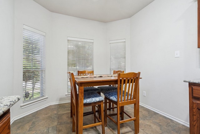 6132 Farrah Dr, Fort Worth, TX 76131 - dining room with baseboards and dark stone finish floors