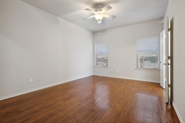 6132 Farrah Dr, Fort Worth, TX 76131 - empty room with a ceiling fan, dark wood-style floors, and baseboards