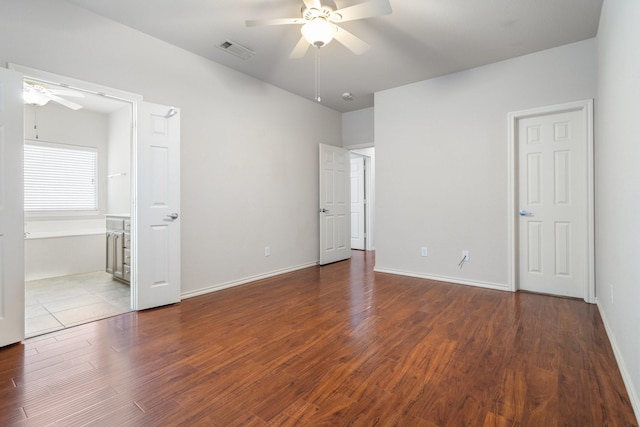 6132 Farrah Dr, Fort Worth, TX 76131 - unfurnished bedroom featuring wood finished floors, baseboards, ceiling fan, and ensuite bathroom