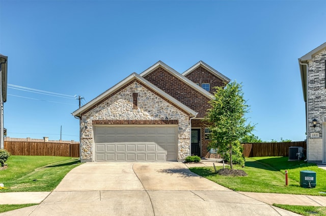 101 Goosewood Dr, Mckinney, TX 75071 - view of front of property featuring central AC unit, stone siding, an attached garage, and driveway