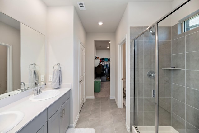 101 Goosewood Dr, Mckinney, TX 75071 - full bath featuring double vanity, a stall shower, toilet, tile patterned floors, and recessed lighting