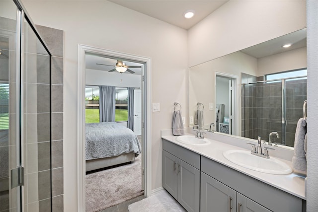 101 Goosewood Dr, Mckinney, TX 75071 - ensuite bathroom with double vanity, healthy amount of natural light, a tile shower, a ceiling fan, and recessed lighting