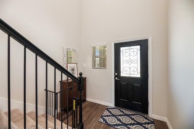 101 Goosewood Dr, Mckinney, TX 75071 - foyer entrance featuring baseboards, dark wood-style floors, a towering ceiling, and stairs