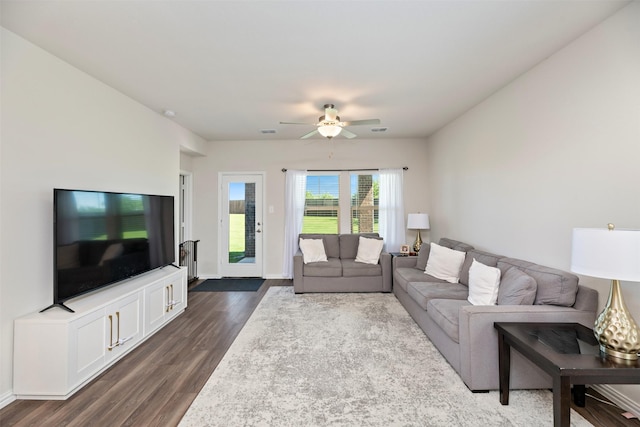101 Goosewood Dr, Mckinney, TX 75071 - living area featuring dark wood-style flooring, a ceiling fan, and baseboards