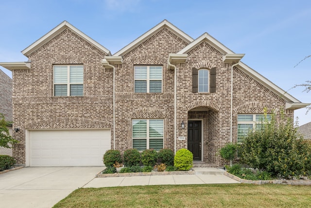 906 Overton Ave, Celina, TX 75009 - view of front of property featuring brick siding, driveway, and a garage