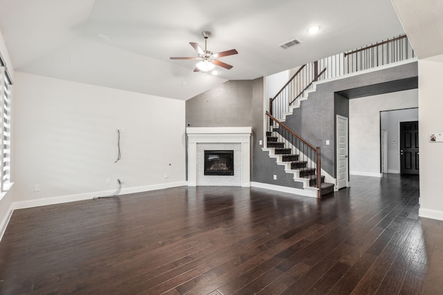 906 Overton Ave, Celina, TX 75009 - unfurnished living room featuring ceiling fan, a glass covered fireplace, stairs, wood finished floors, and baseboards