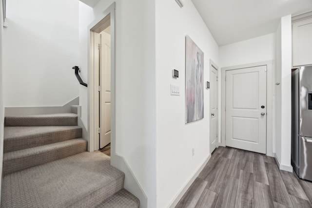 317 Mcconathy Way, Flower Mound, TX 75028 - corridor with wood finished floors, stairs, and baseboards