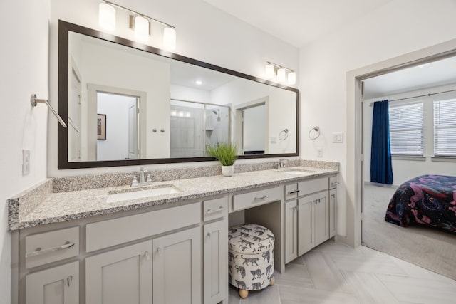 317 Mcconathy Way, Flower Mound, TX 75028 - bathroom with double vanity, a shower stall, and ensuite bath