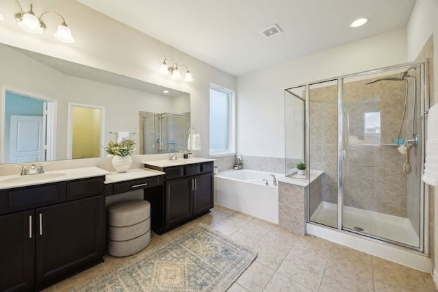 1901 Brahorn Ln, Fort Worth, TX 76131 - bathroom with double vanity, tile patterned flooring, a garden tub, a shower stall, and recessed lighting