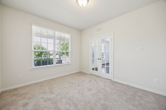 1901 Brahorn Ln, Fort Worth, TX 76131 - empty room featuring carpet flooring, baseboards, and french doors