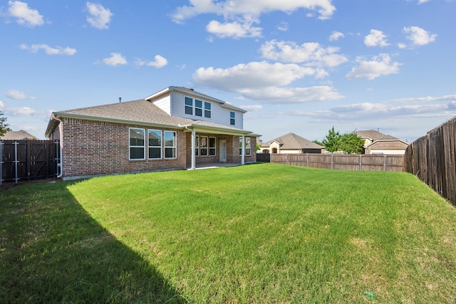 1901 Brahorn Ln, Fort Worth, TX 76131 - back of property featuring brick siding, a shingled roof, and a patio area