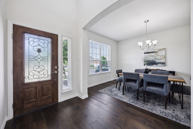 1901 Brahorn Ln, Fort Worth, TX 76131 - entryway featuring a chandelier, arched walkways, dark wood-style flooring, and baseboards