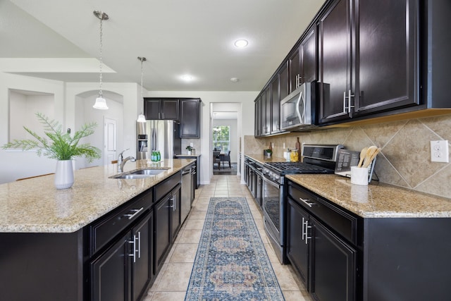 1901 Brahorn Ln, Fort Worth, TX 76131 - kitchen featuring stainless steel appliances, a sink, tasteful backsplash, light stone counters, and recessed lighting