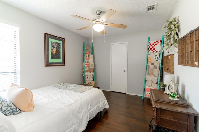 6304 Kary Lynn Dr S, Watauga, TX 76148 - bedroom with wood finished floors, a textured ceiling, and ceiling fan